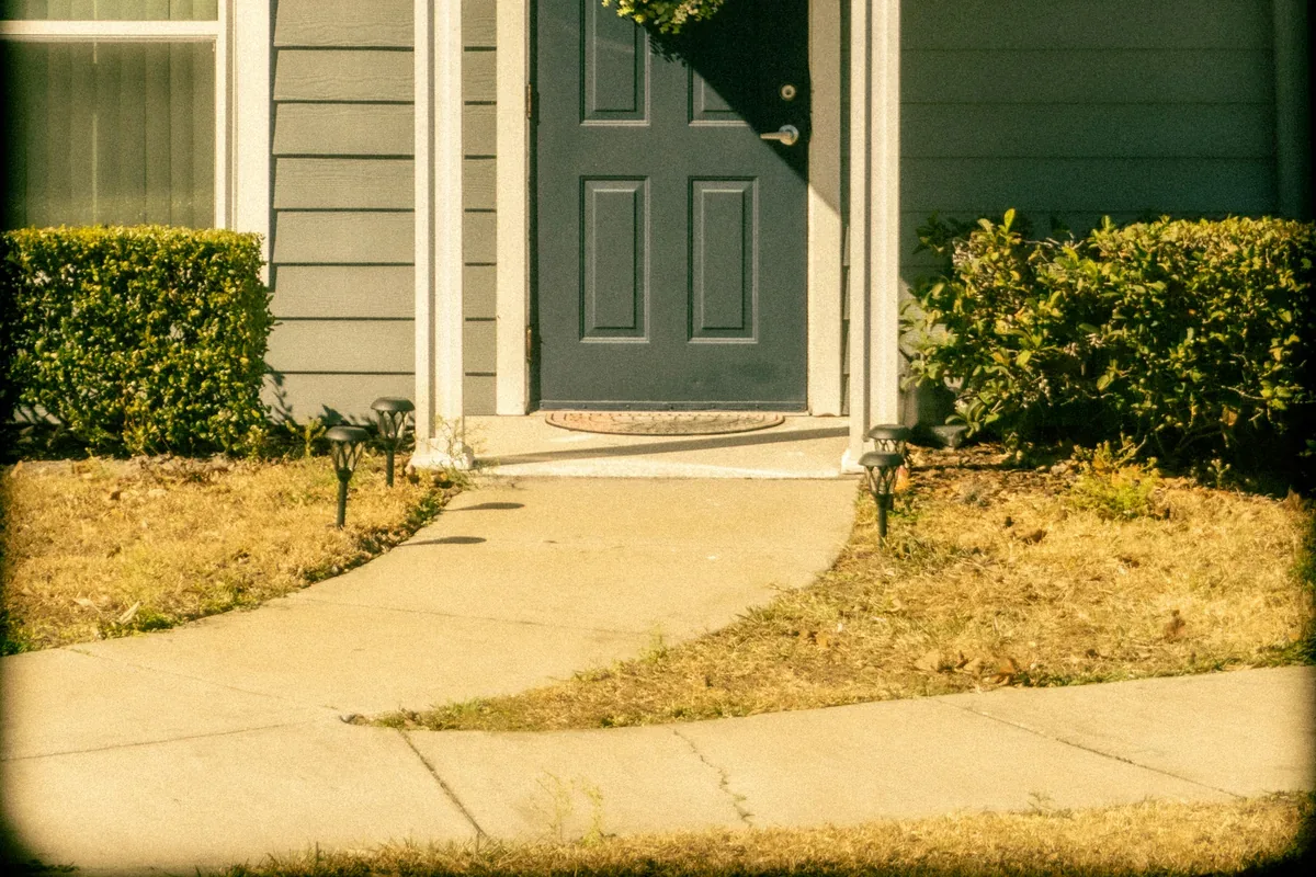 Front door decorated with a fall wreath (harvest season decor)