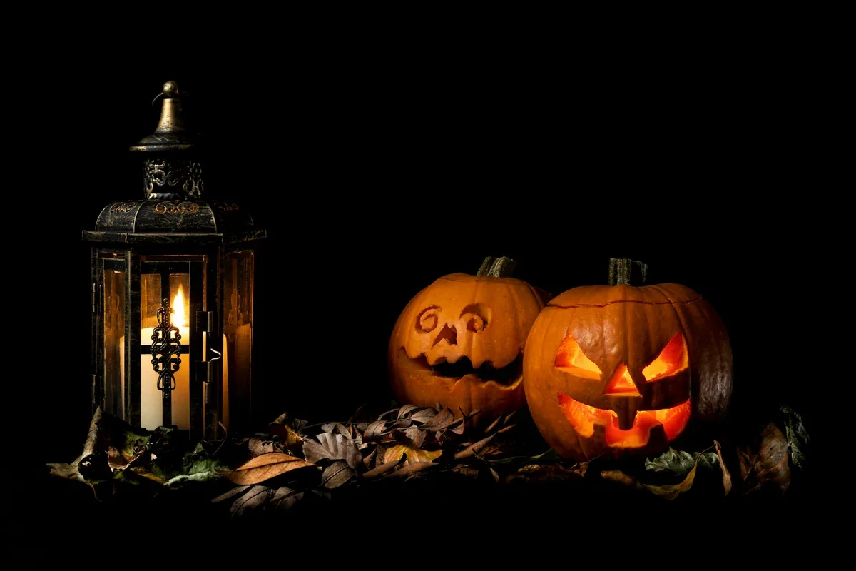 Halloween paper pumpkin lantern with a warm glow