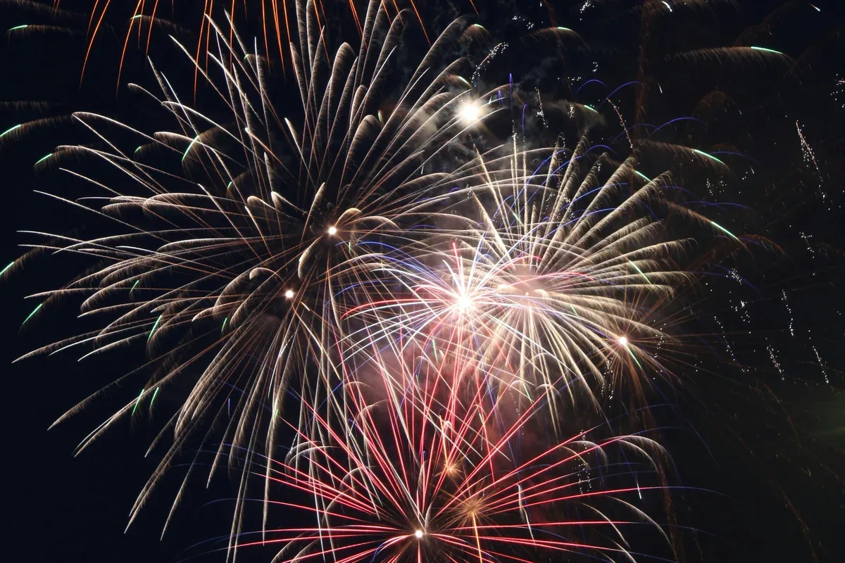 Paper fireworks backdrop in red, white, and blue tones